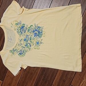 Lightweight yellow t-shirt with blue and green pattern on front. NWT. Van Heusen